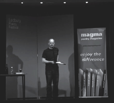 Photograph of Don Paterson reading on stage
